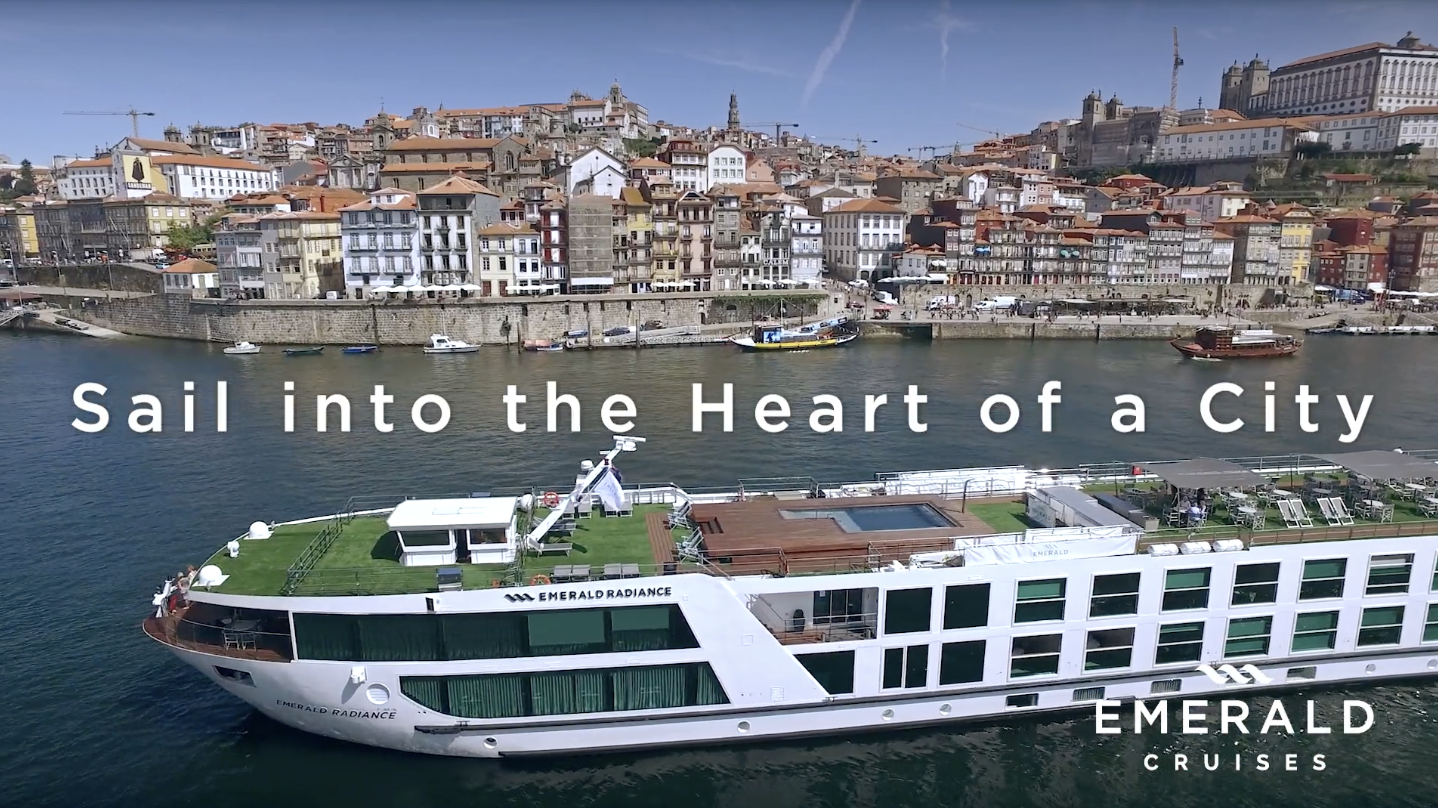 Emerald River Cruise ship with background city and logo.png