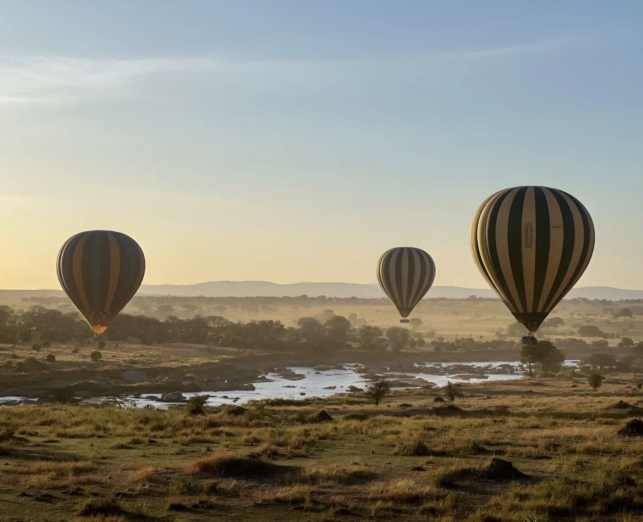 African Safari image of balloons looking over the Serengeti experience with Pan AM Private Jet Experience