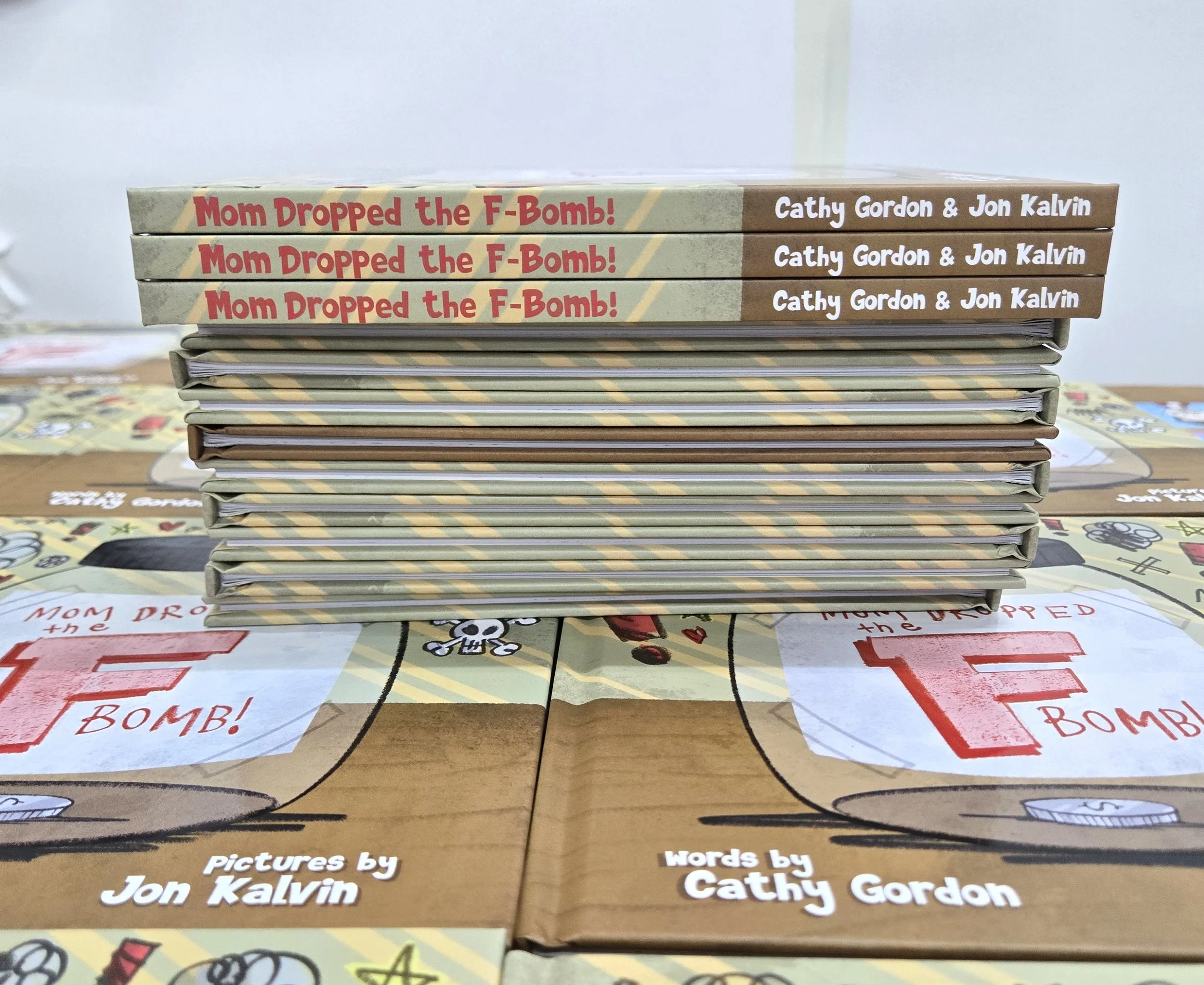 Stack of finished Mom Dropped the F-Bomb picture books on the print shipment, ready for the next stage of the self-publishing journey.