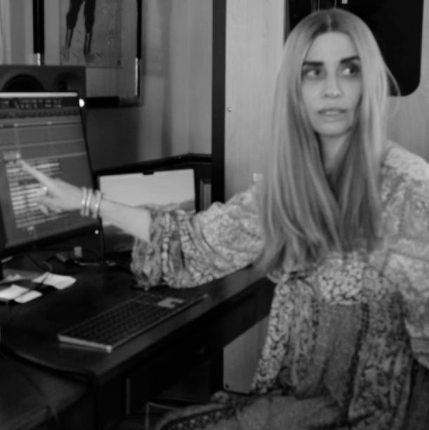 Julia Blum reviewing a music production session on her studio computer.