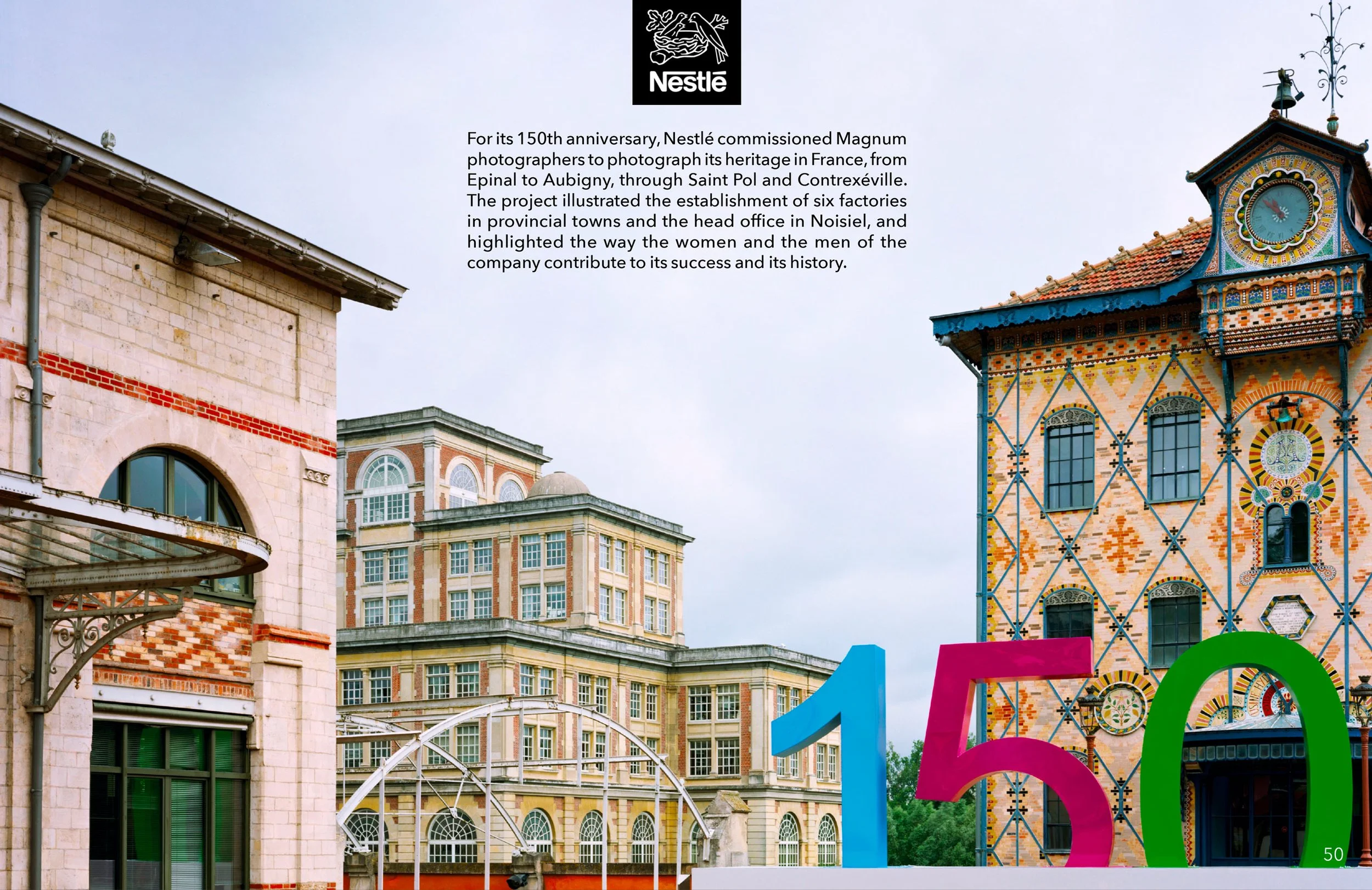 Buildings with colorful architectural details and the Nestlé logo, celebrating its 150th anniversary with a display of large artistic installations and a cityscape background.