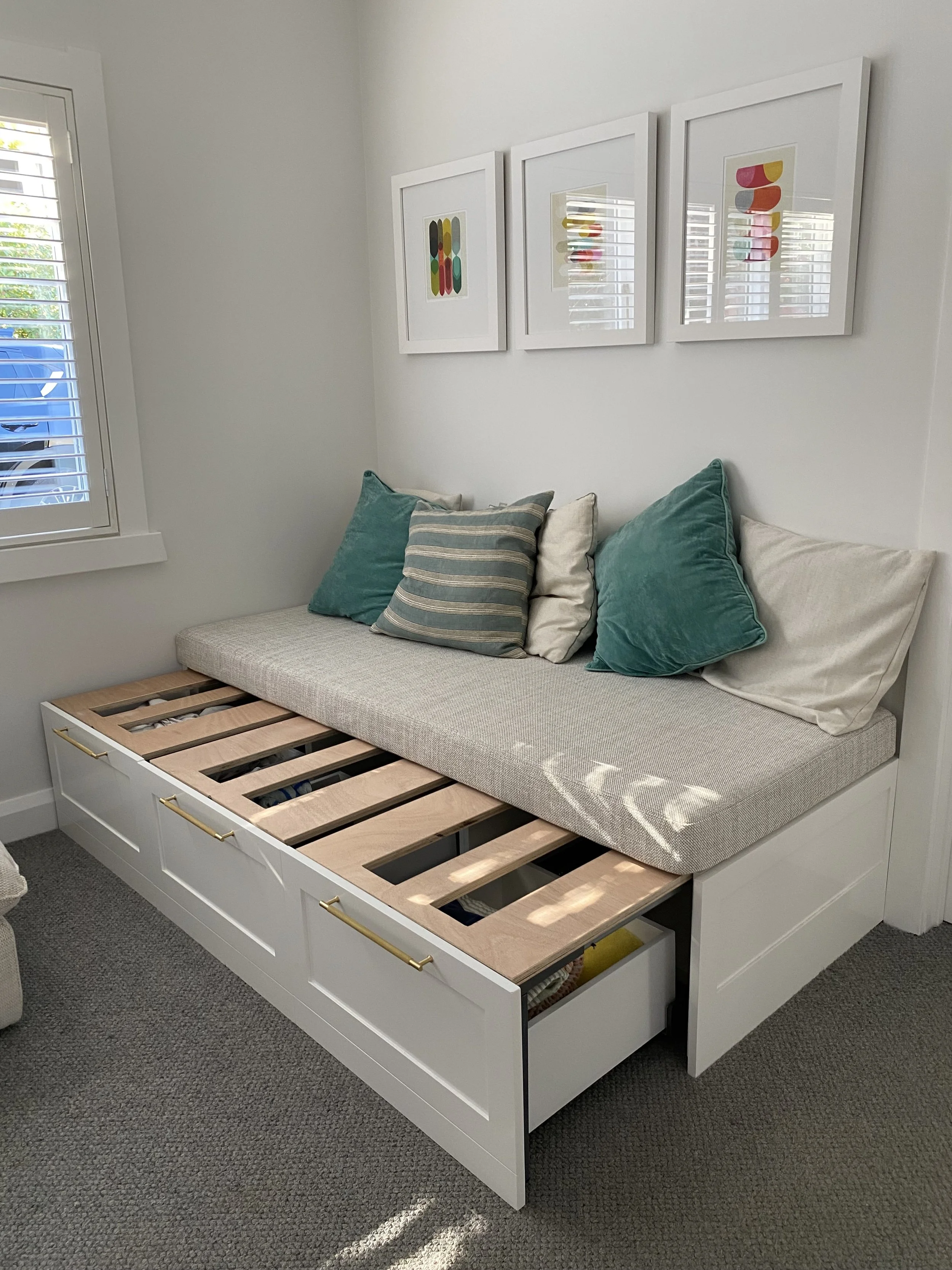 Pull-out bed that also is a bench seat. With multiple drawers underneath. The ultimate storage solution and bed for extra guests