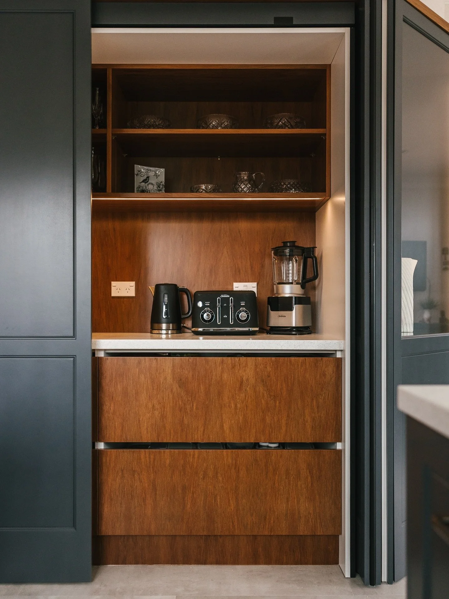 Pantry open on display, or hidden away ✨

Timber pantry tucked behind a @blumnewzealand Revego pocket door. Open when you need it, easy to access and letting the timber details shine - or hidden when you don&rsquo;t, tucked away keeping the kitchen c