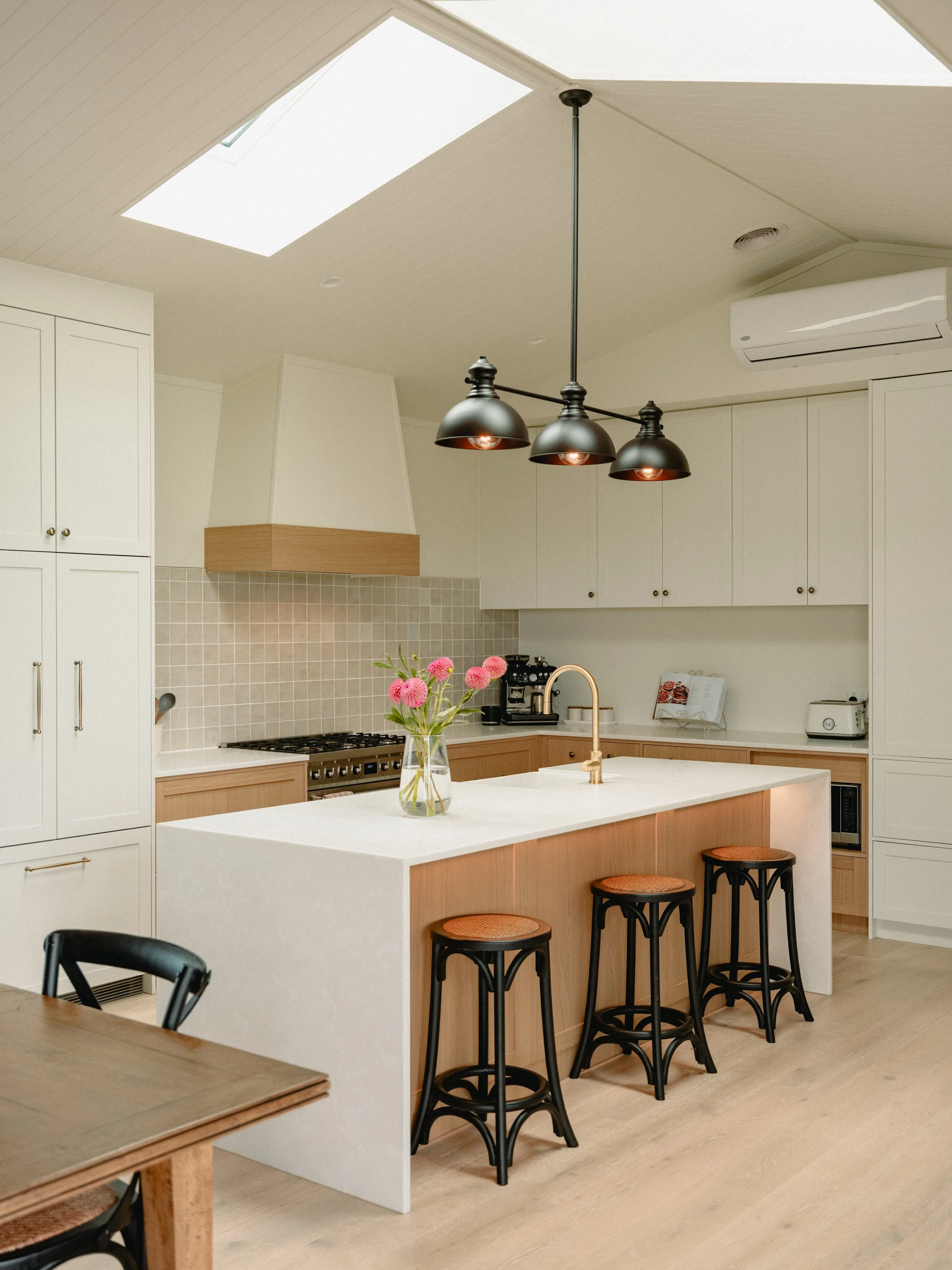 modern farm-style kitchen with beautiful white and timber materials. a stylish and stunning family home and kitchen to suit.