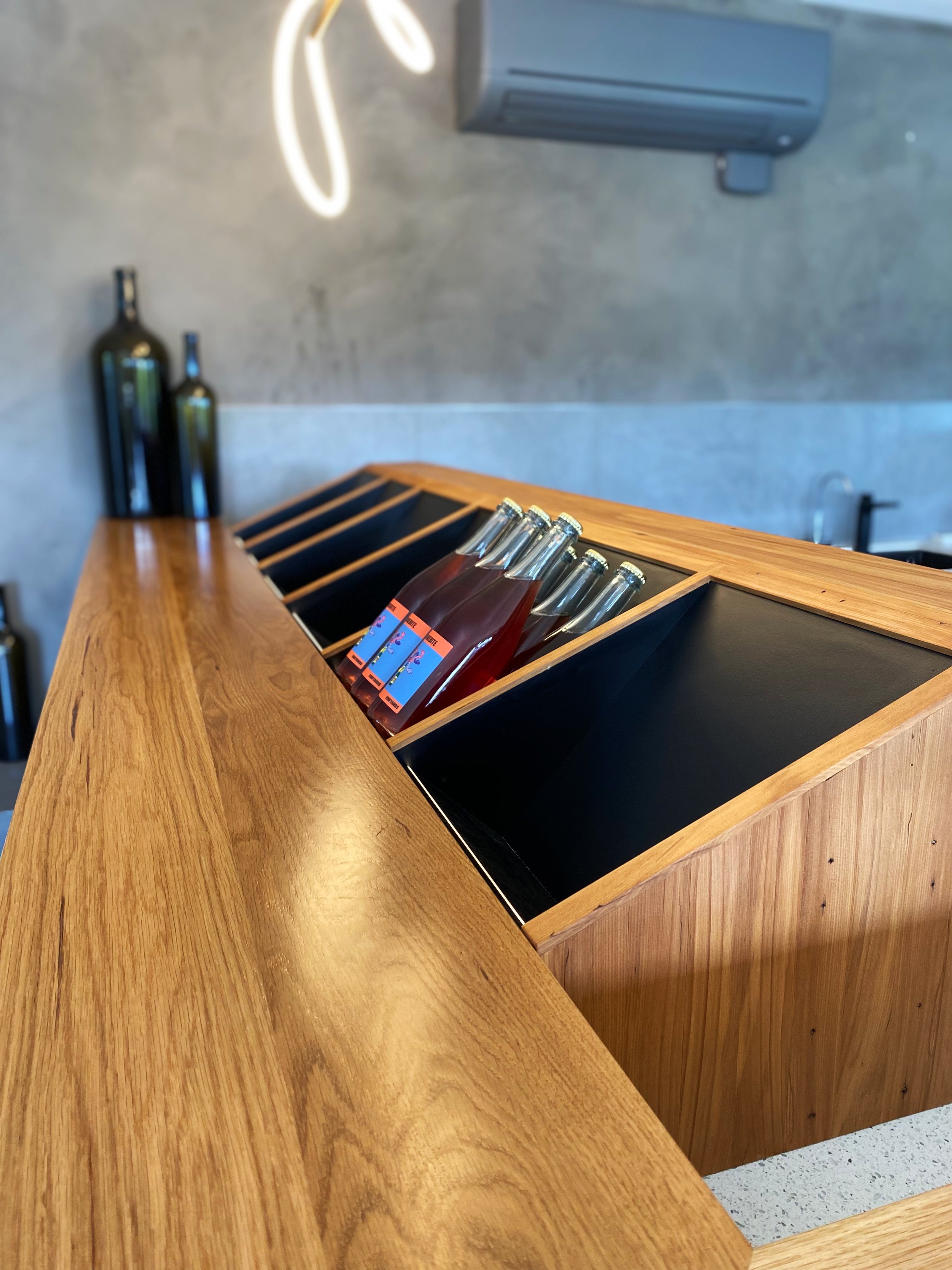 A custom timber unit to store wine bottles in a professional and create way.