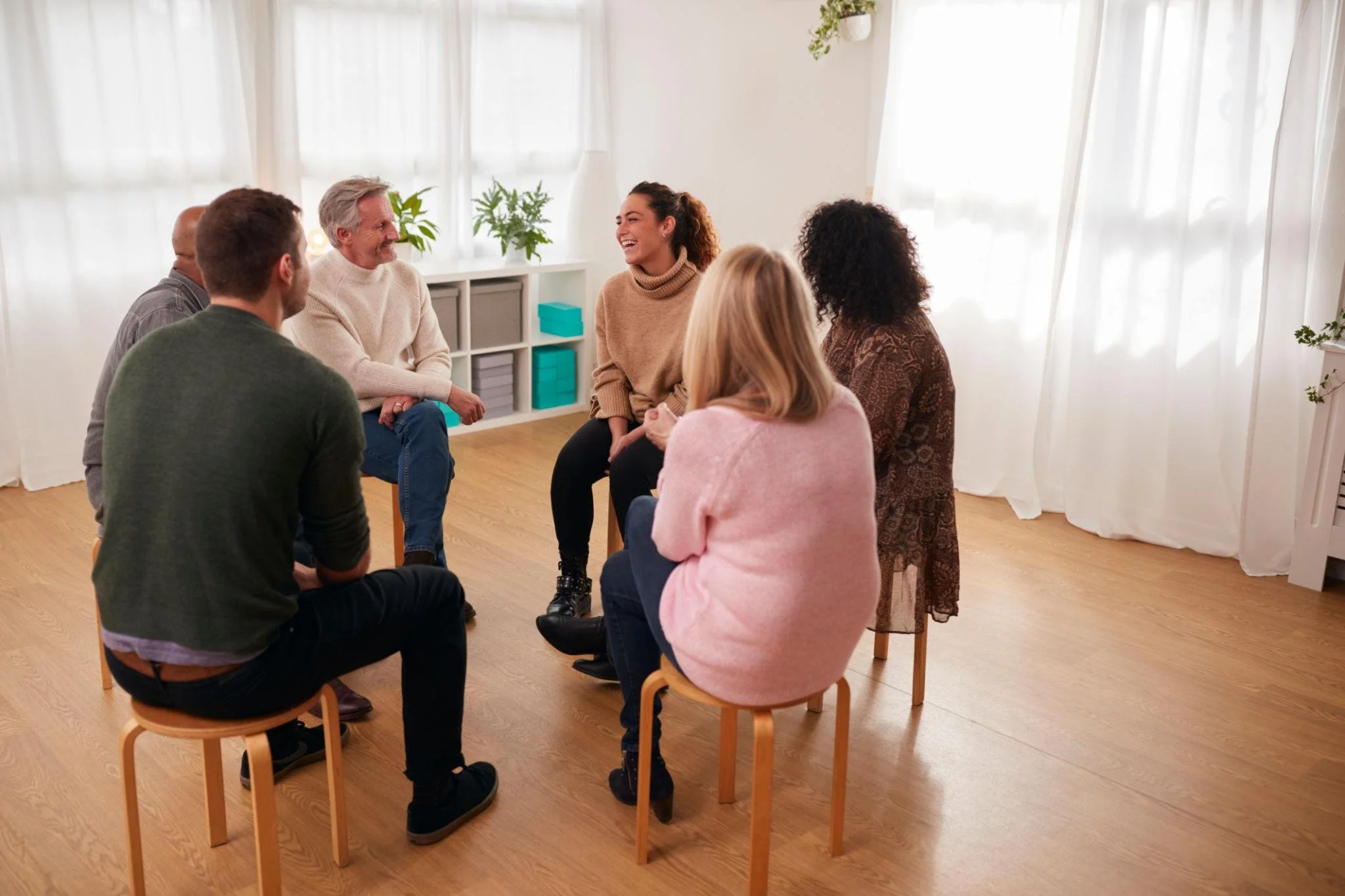 A group of people sitting in a circle