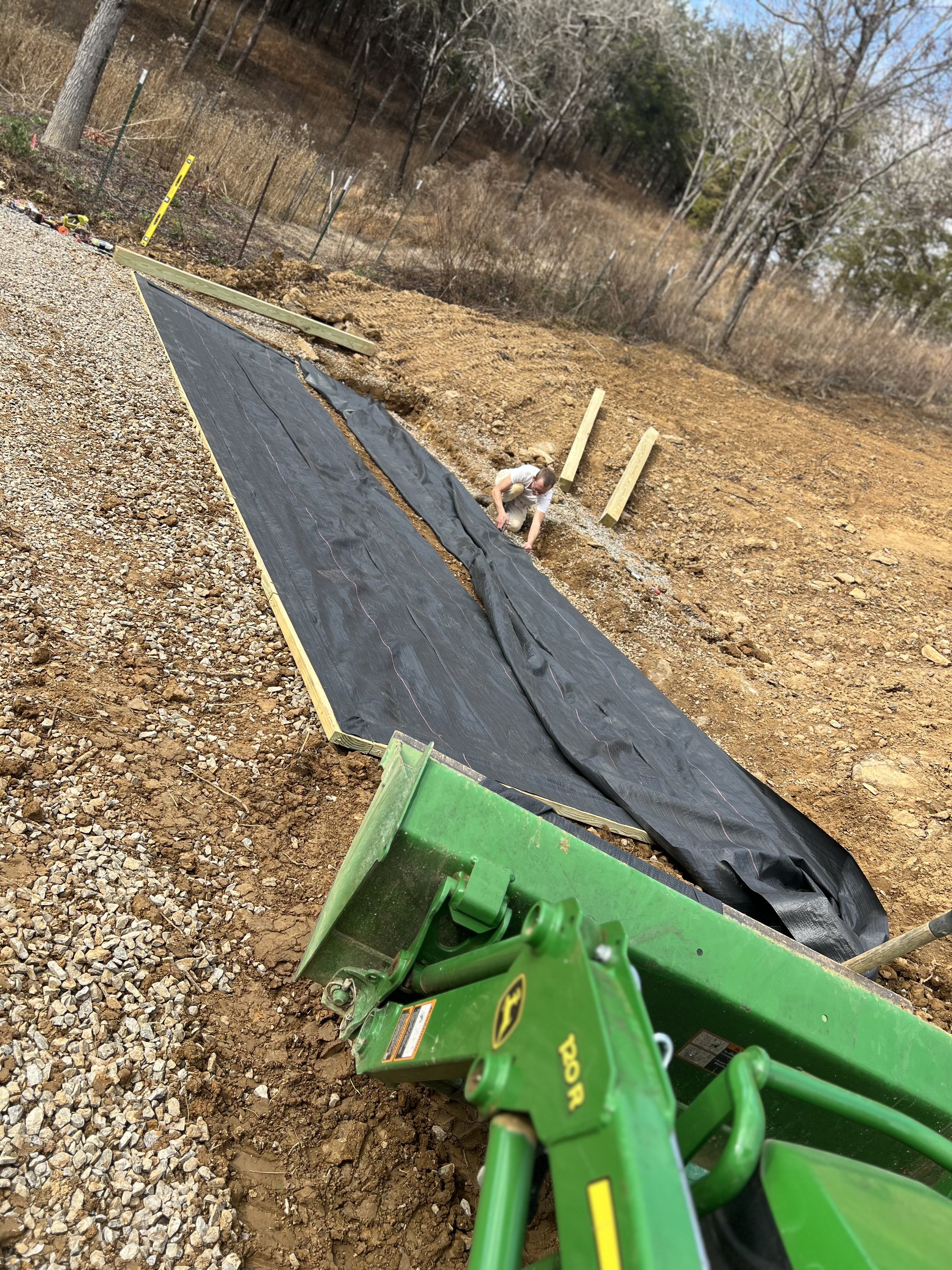 Hands-on construction of a new greenhouse near the barn and main garden at Maple Valley Farm, showing the behind-the-scenes work that supports growing flowers and nurturing life in the Smoky Mountain valley.