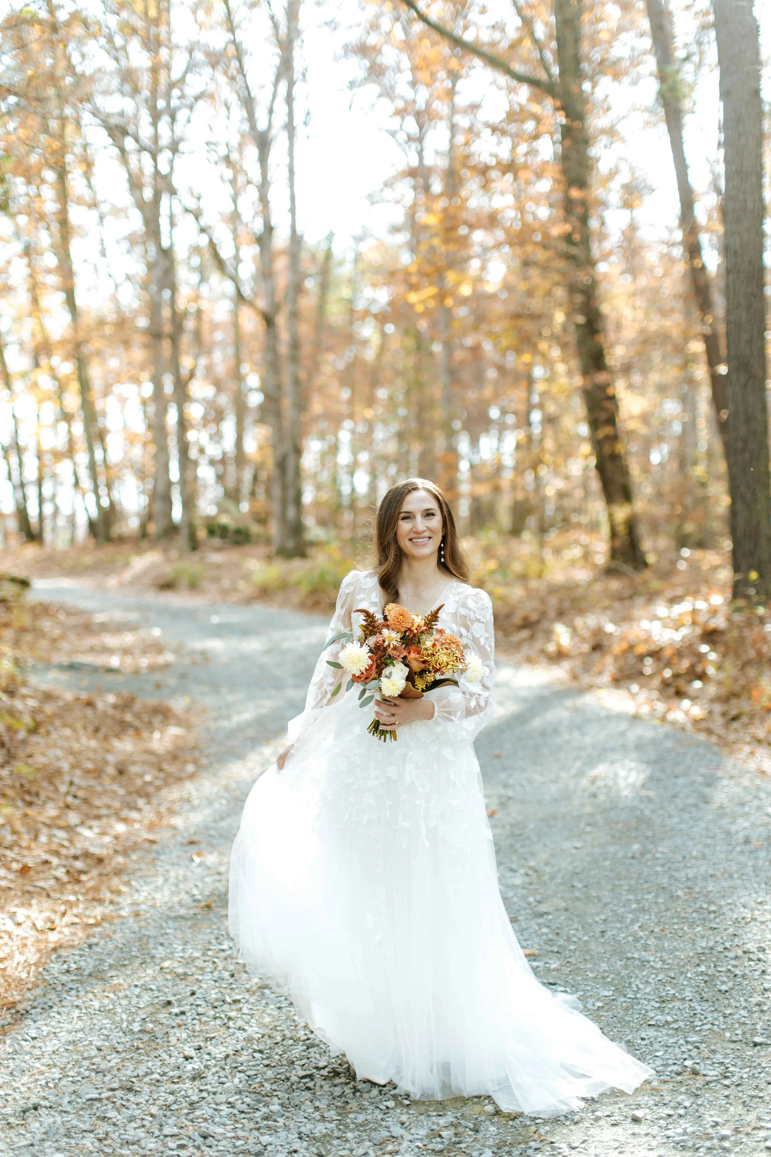 A NC bride poses with her fall garden bouquet at Union Grove Farm