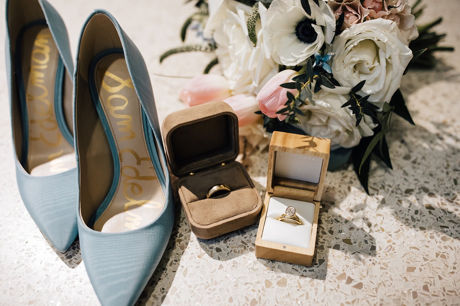 A closeup of a Raleigh microwedding couples wedding rings and bouquet