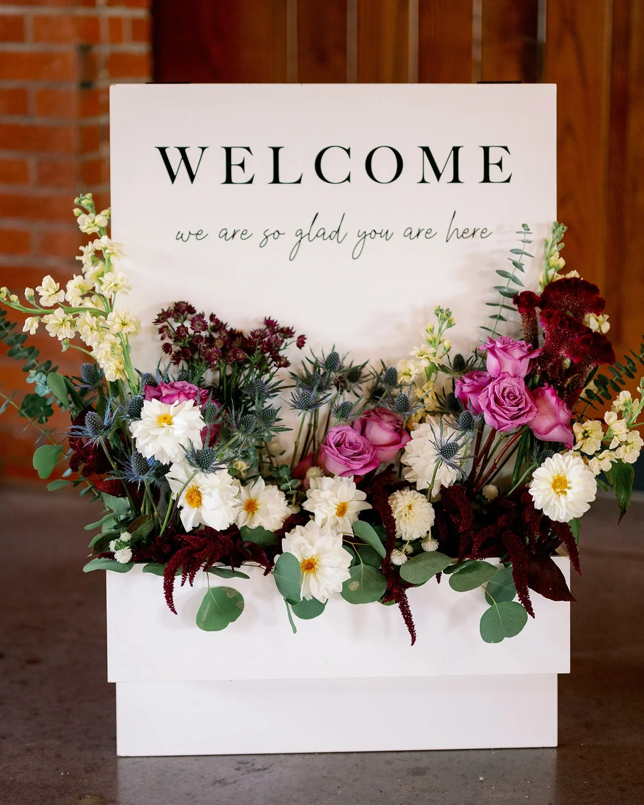 Wedding welcome sign with DIY + Design flowers from Buck Naked Farm in Pittsboro