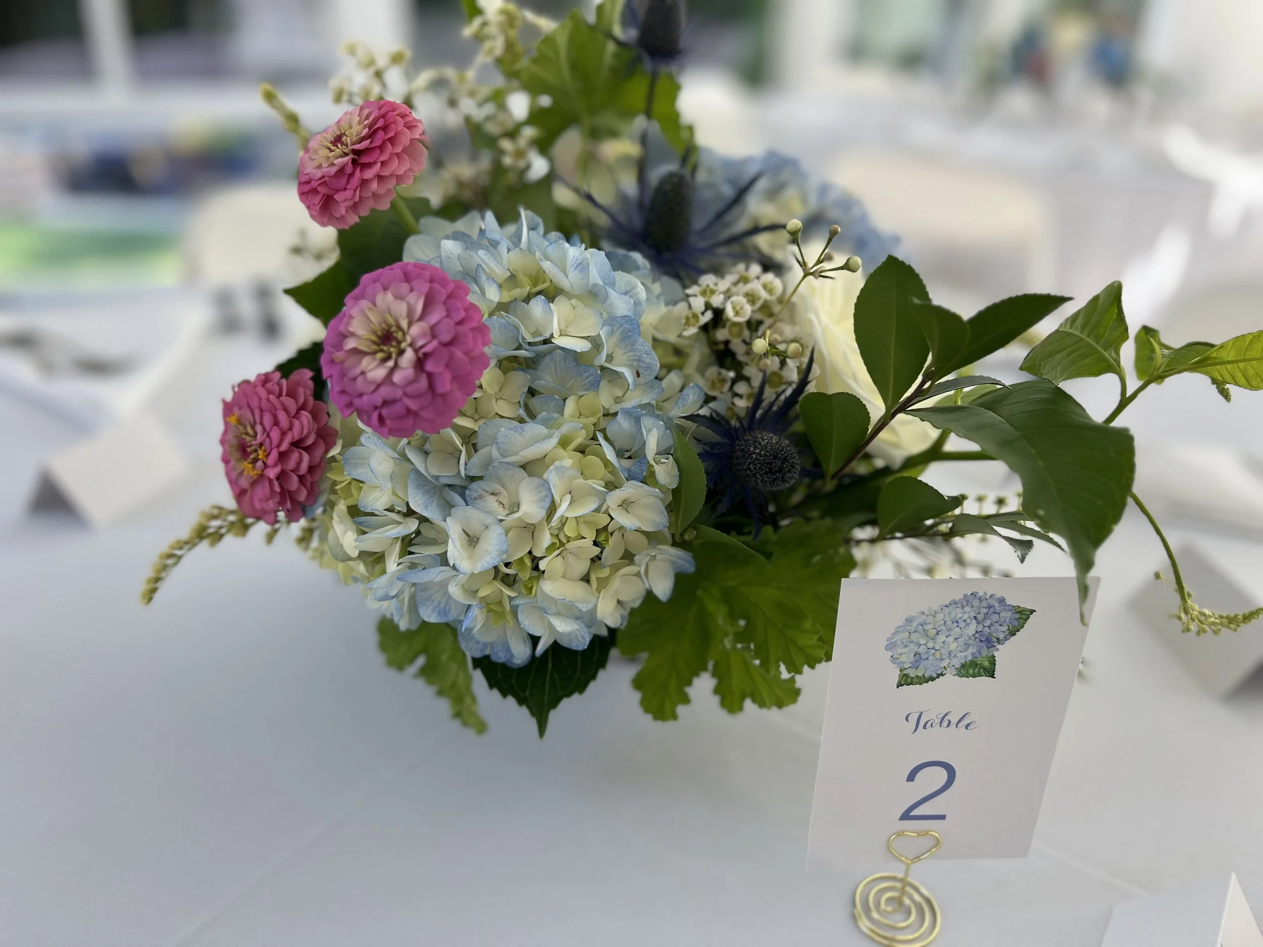 Pastel blue and pink reception flower centerpiece in Apex, NC