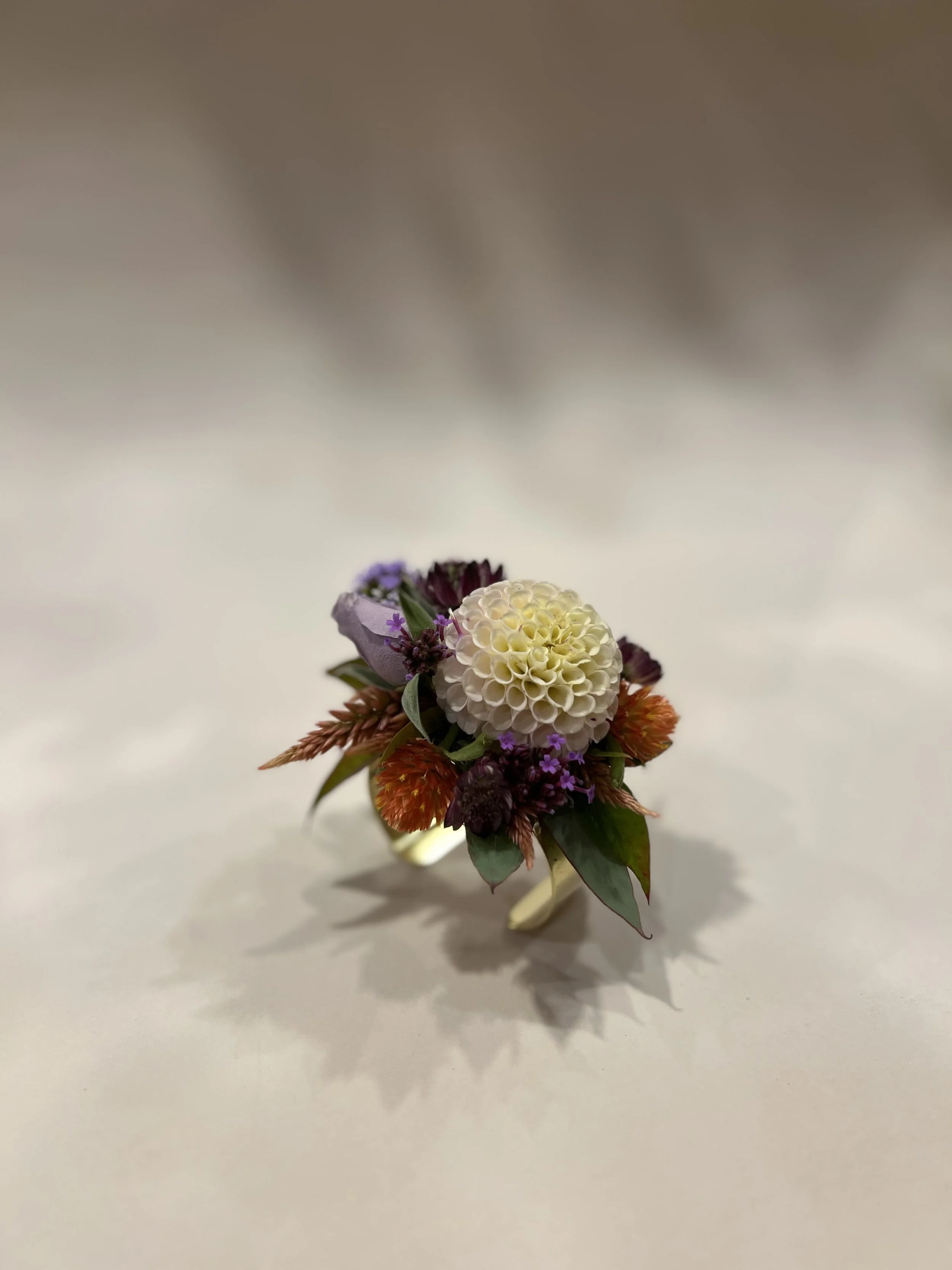 White and lavender wrist corsage from Buck Naked Farm