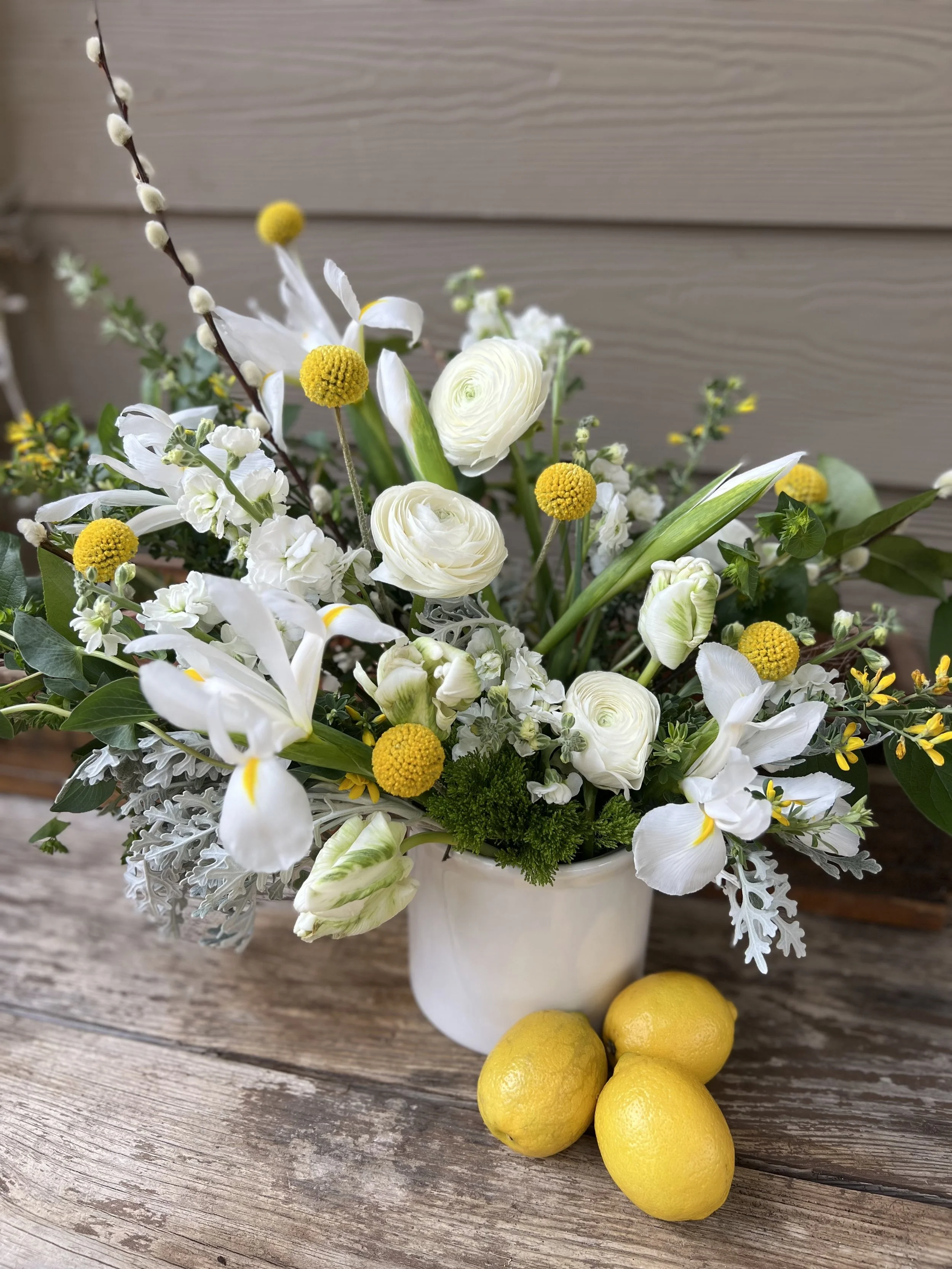 Yellow and white flower arrangement for a winter bridal shower in chapel hill, nc