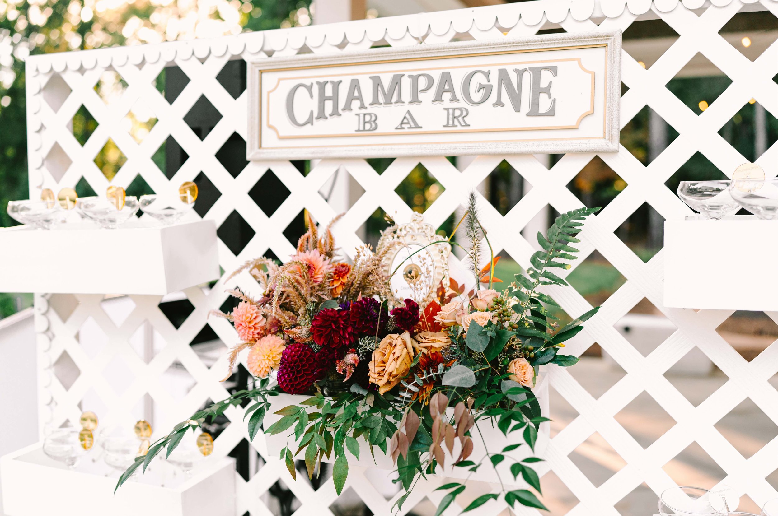 Floral arrangement for fall birthday champagne bar in apex, nc