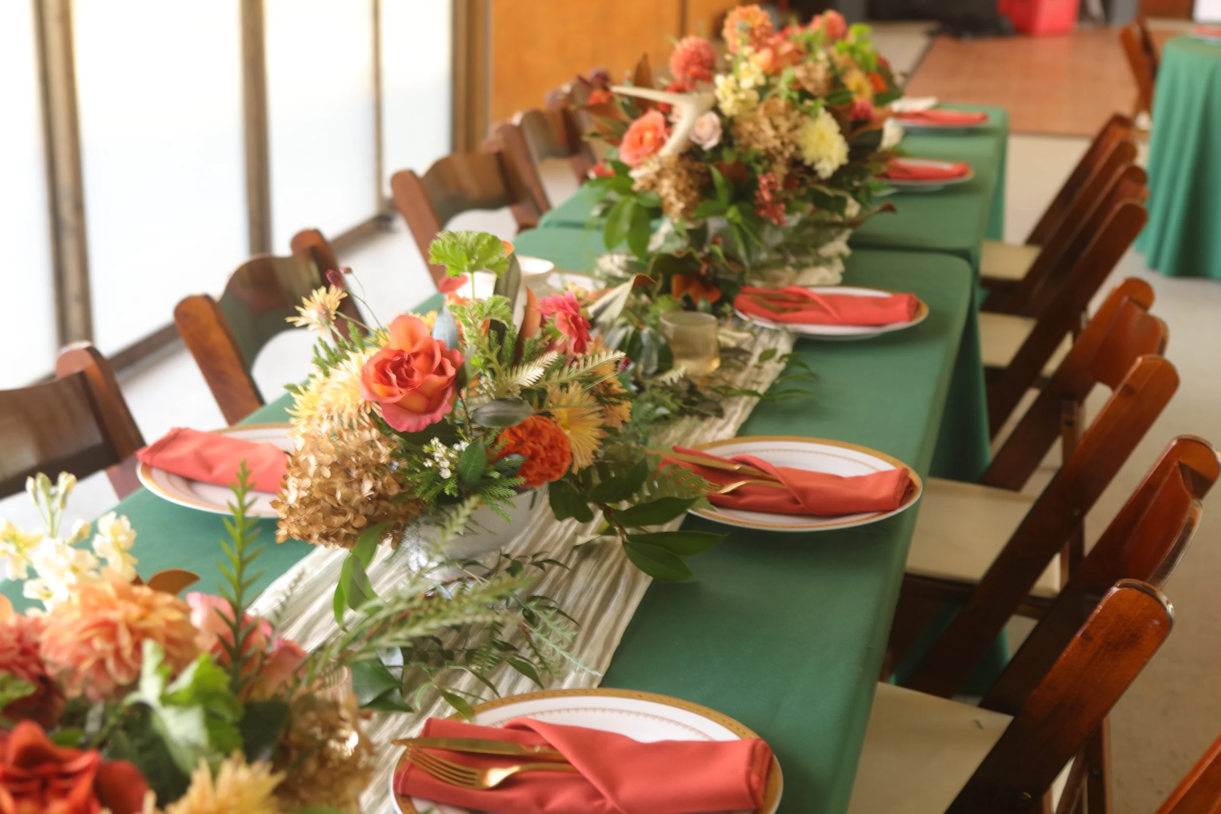 Rust and green wedding sweetheart table at Honeysuckle Tea House for a fall garden wedding