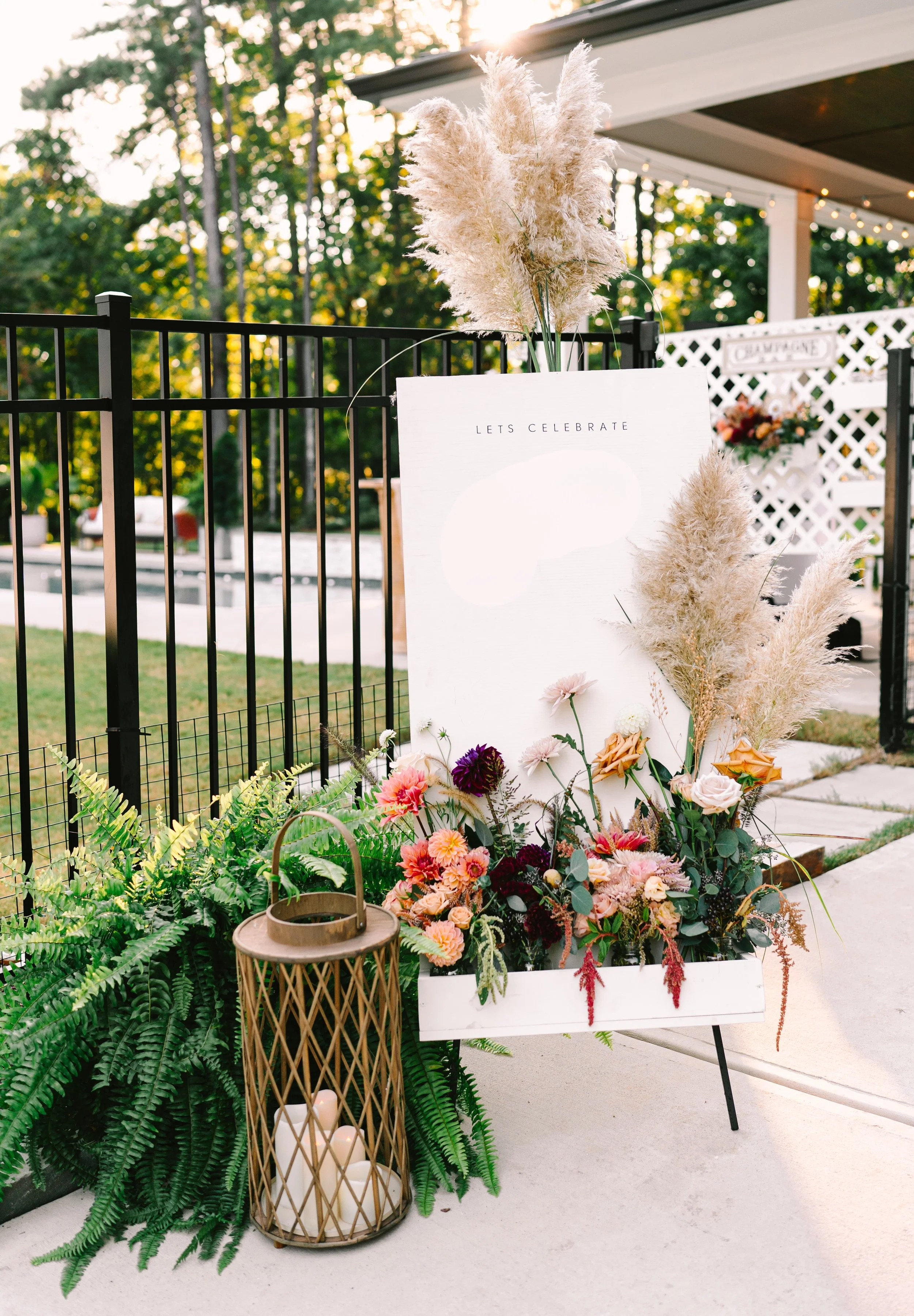 a birthday welcome sign with fall florals from Buck Naked Farm in Pittsboro, NC