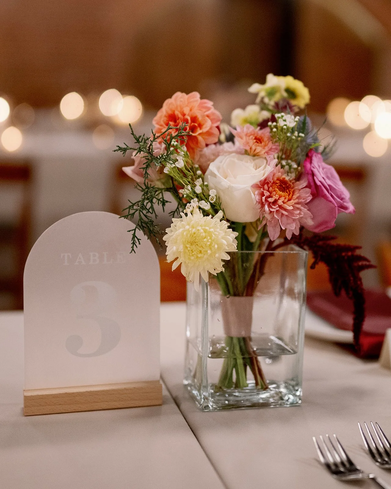 Bridesmaid bouquet in a vase at the Cookery in Durham, NC