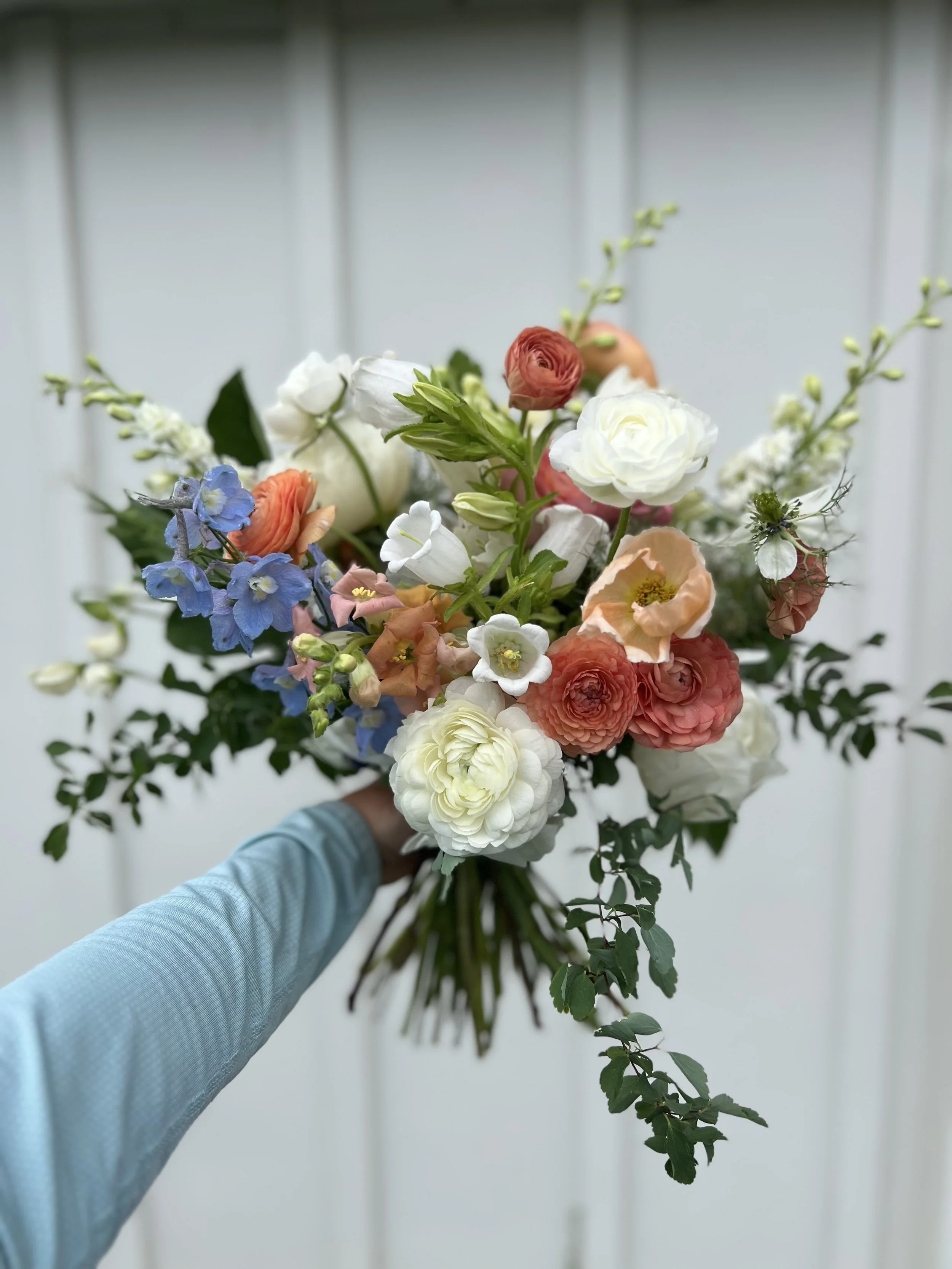 Peach and blue wedding bouquet from Buck Naked Farm in Pittsboro, NC