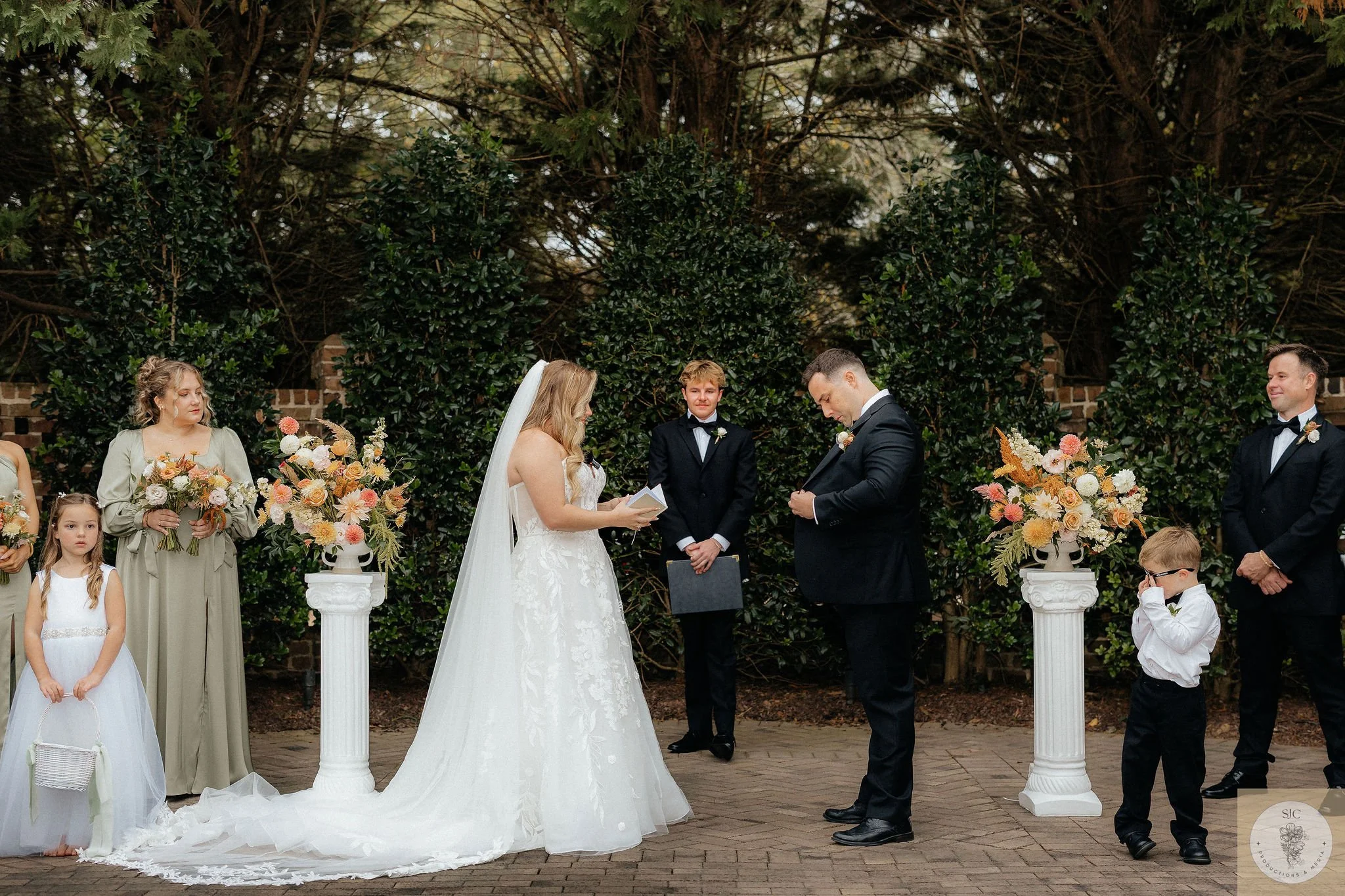 Fall peach and sage wedding altar flowers at the Sutherland in Raleigh, NC