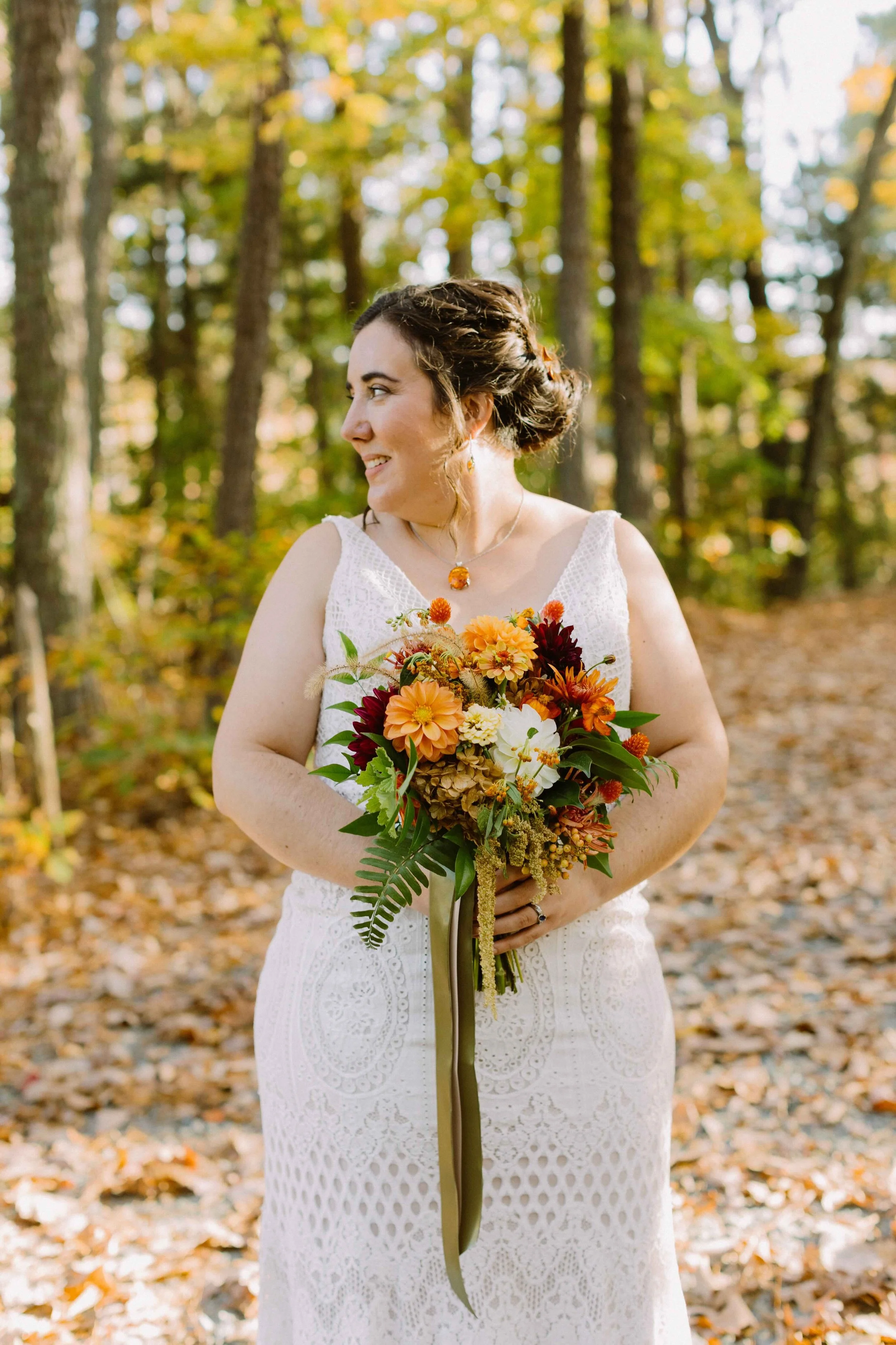 Bride with burnt orange and burgundy fall wedding bouquet in Chapel Hill, NC