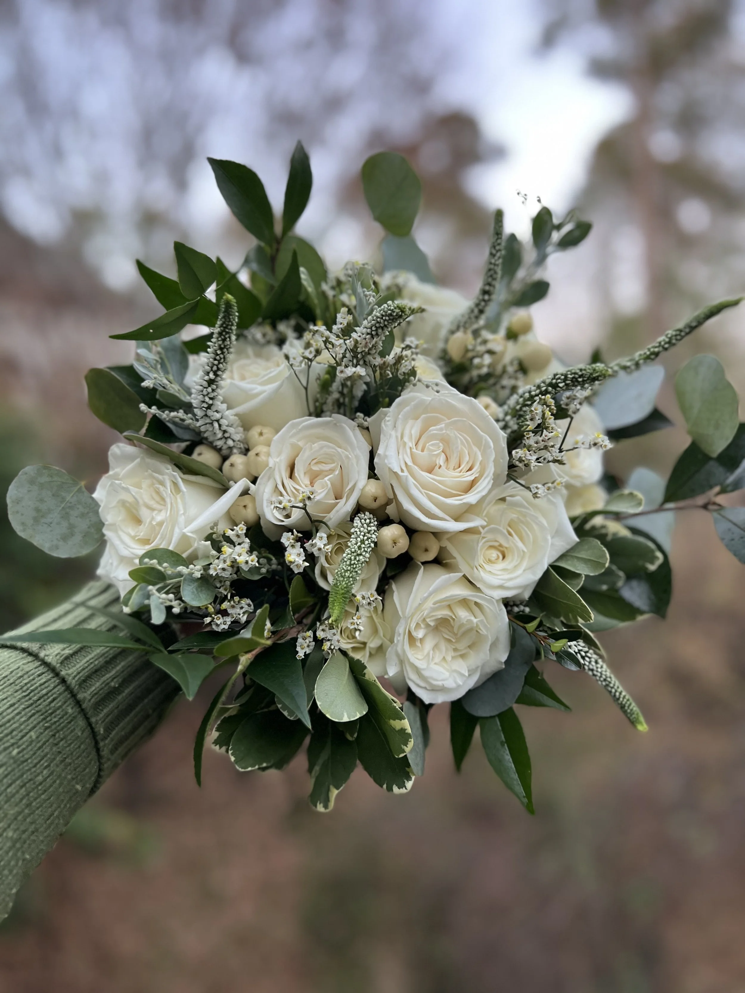 green and white winter wedding bouquet in Apex, NC
