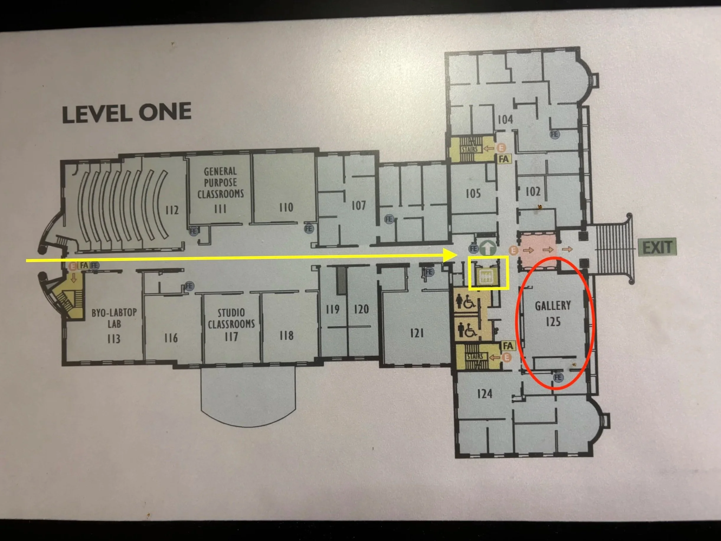 Floor Plan showing the first floor with an arrow leading across the building to an elevator on its right