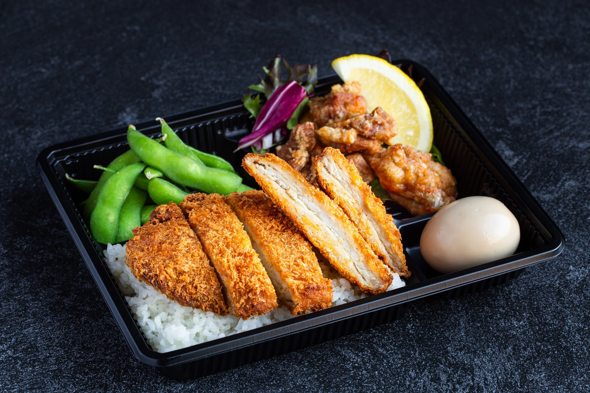 Tonkatsu to go bento box alonog with Karaage and ajitama