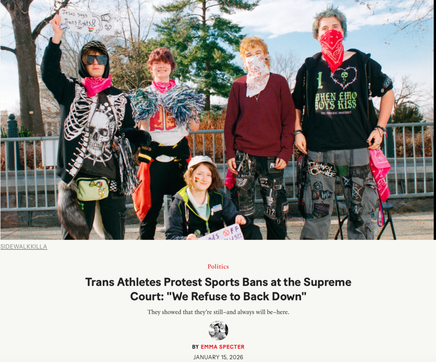 Group of five people protesting in support of trans athletes and against sports bans, holding signs and dressed in punk and LGBTQ+ themed clothing, outdoors with trees and a fence in the background.