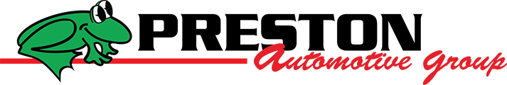 Logo of an automotive group featuring a green frog with glasses and the text 'Automotive Group' in red script.