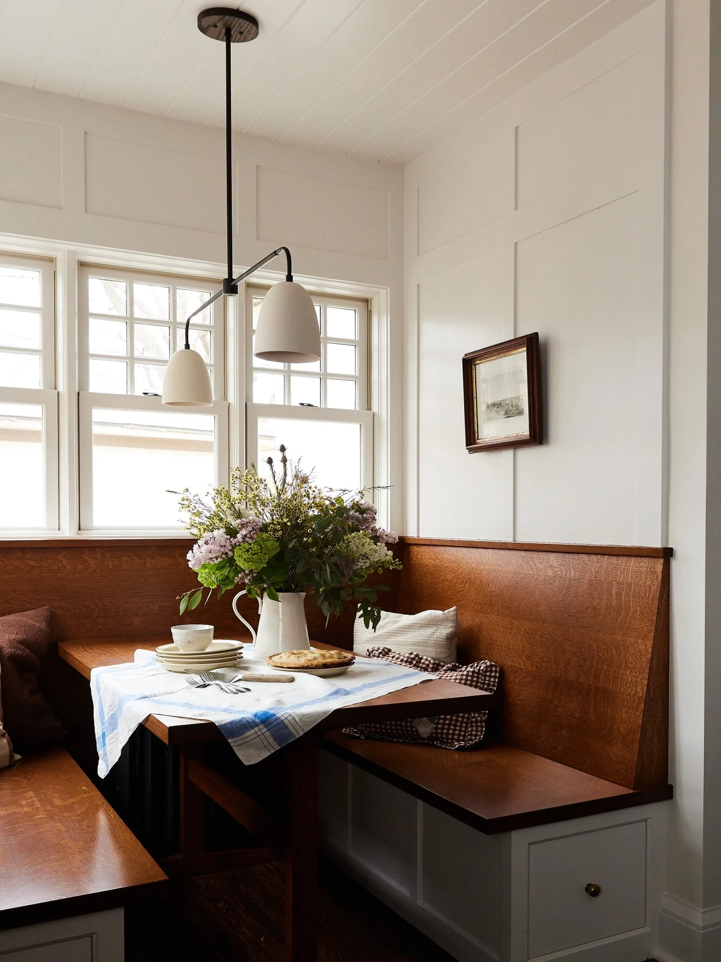 Prior to the renovation, this space lacked a clear direction. 

In partnership with Prospect Refuge Studio, we reimagined the possibilities for a functional banquette for the family to gather.

We especially love how the surrounding windows highlight