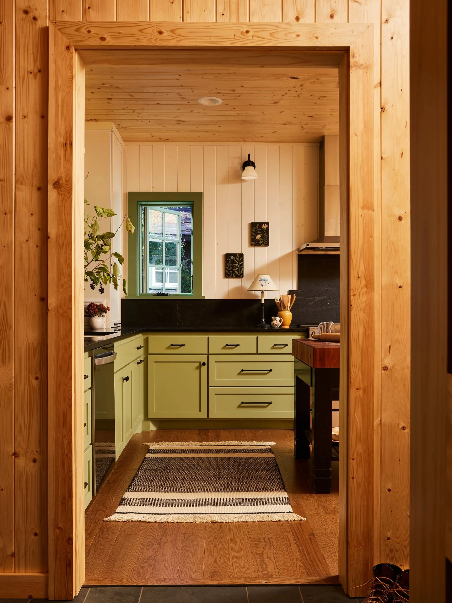 Materials play a vital role in each home, and the Family Camp Cabin is no exception.

Pine paneling throughout the space gives a nod to the original cabin on the property, while creating a durable, rustic feel to the space. In some spaces, we chose t