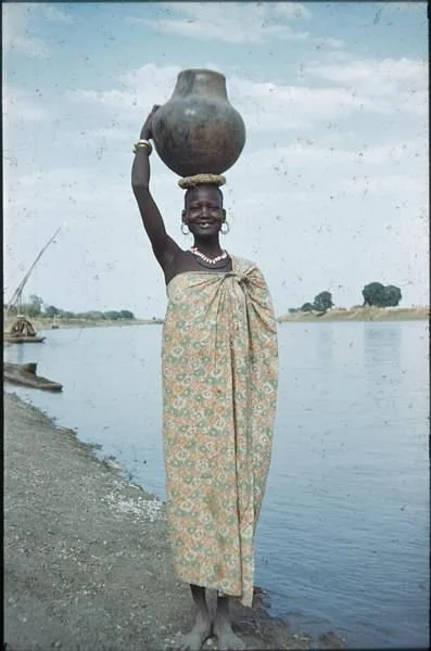 Nuer Woman Carrying Water