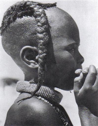 Boy with plait (ozondato and ondengura neckband, from Himba, Namibia. Photographed by Anneliese Scherz circa 1940s. Sourced from Kwekudee.