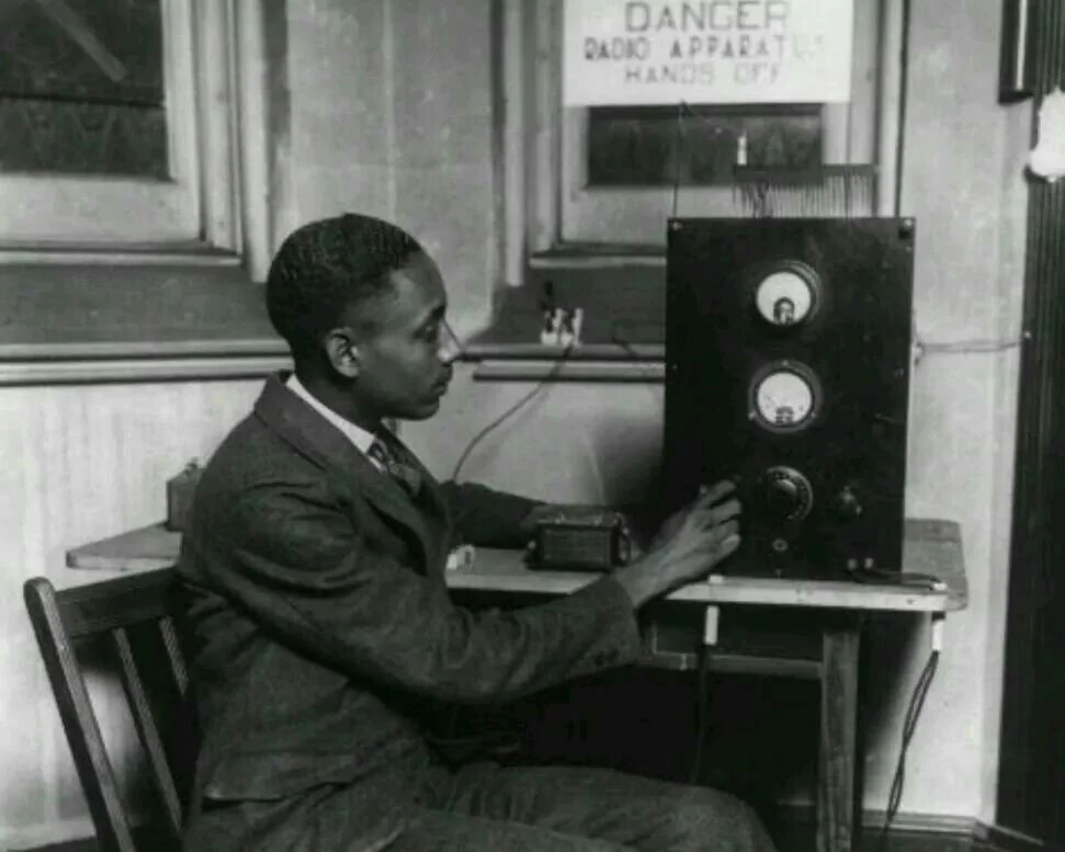 First Black radio station operator, Rufus P. Turner, working on an early radio, likely at his W3LF, 1926 