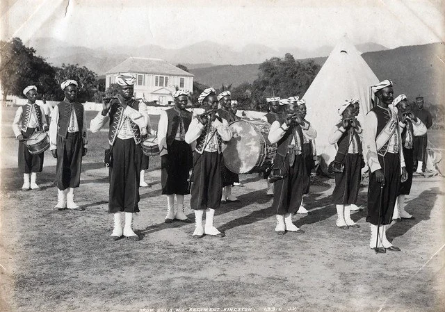 Valentine and Sons. (1891). Drum Band W.I. Regiment. [Photograph]. The Caribbean Photo Archive. https://www.caribbeanphotoarchive.com