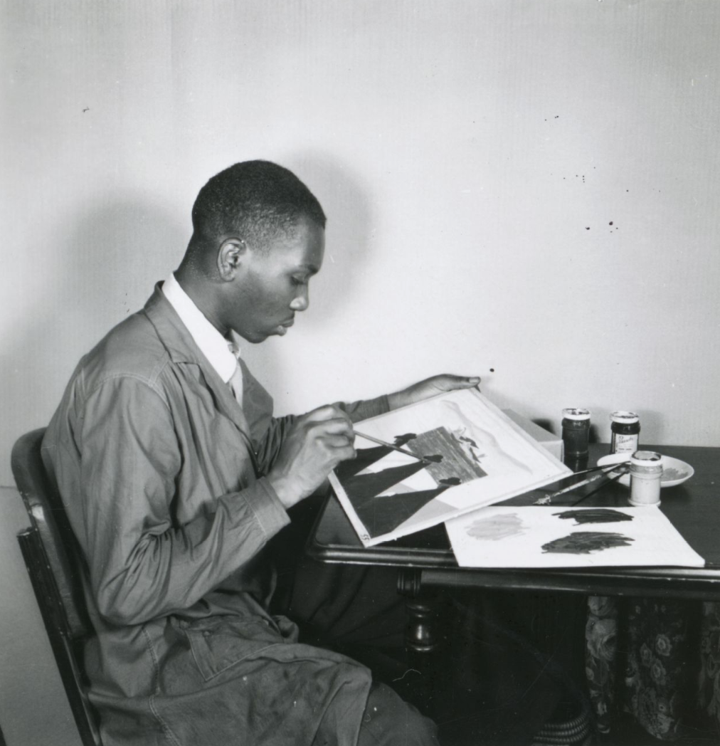 Jacob Lawrence painting his notable art series, The  Migration Series.