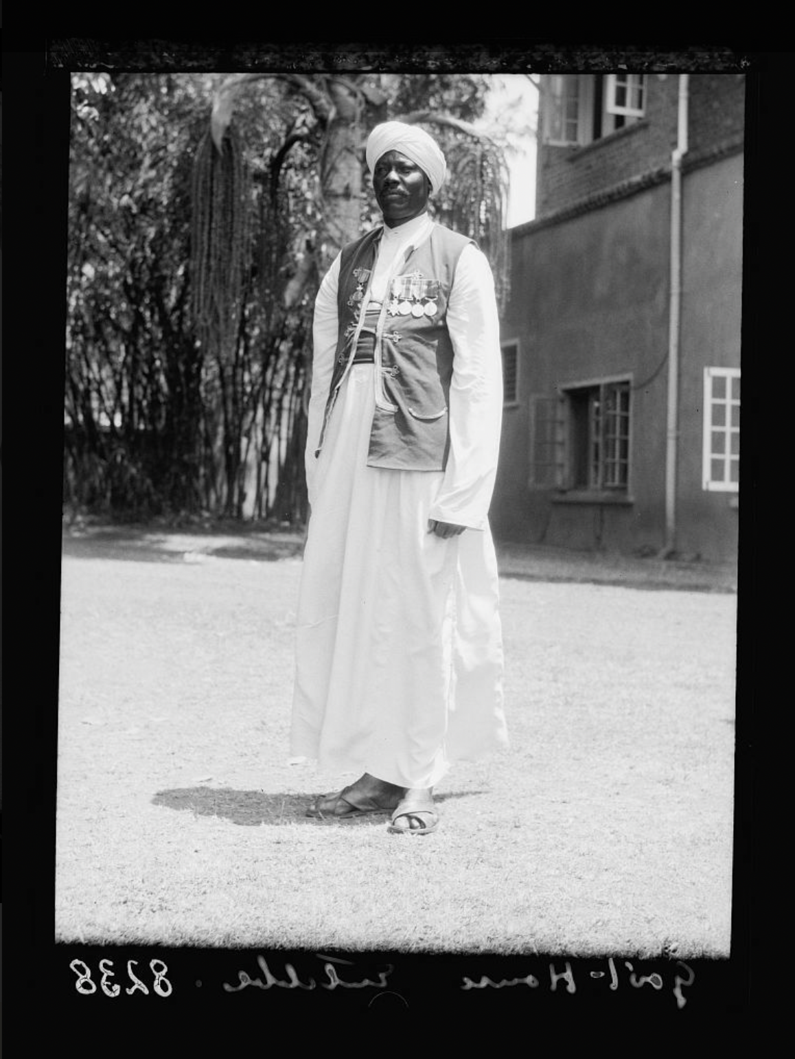 Government House from across the lawn, Nubian guard close up II, Entebbe, Uganda, photograph by Matson Photo Service, 1936. Source: Library of Congress, G. Eric and Edith Matson Photograph Collection.