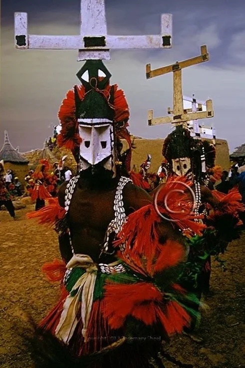 Dogon dancers performing a traditional masked ceremony. Photographed by Rosemary Sheel.