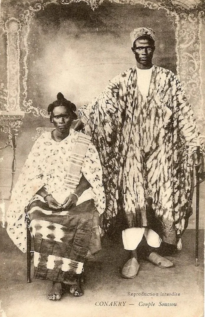 Traditional robes and a matching Hula cap worn by a Sousou (Soussou) couple in Conakry, Guinea.