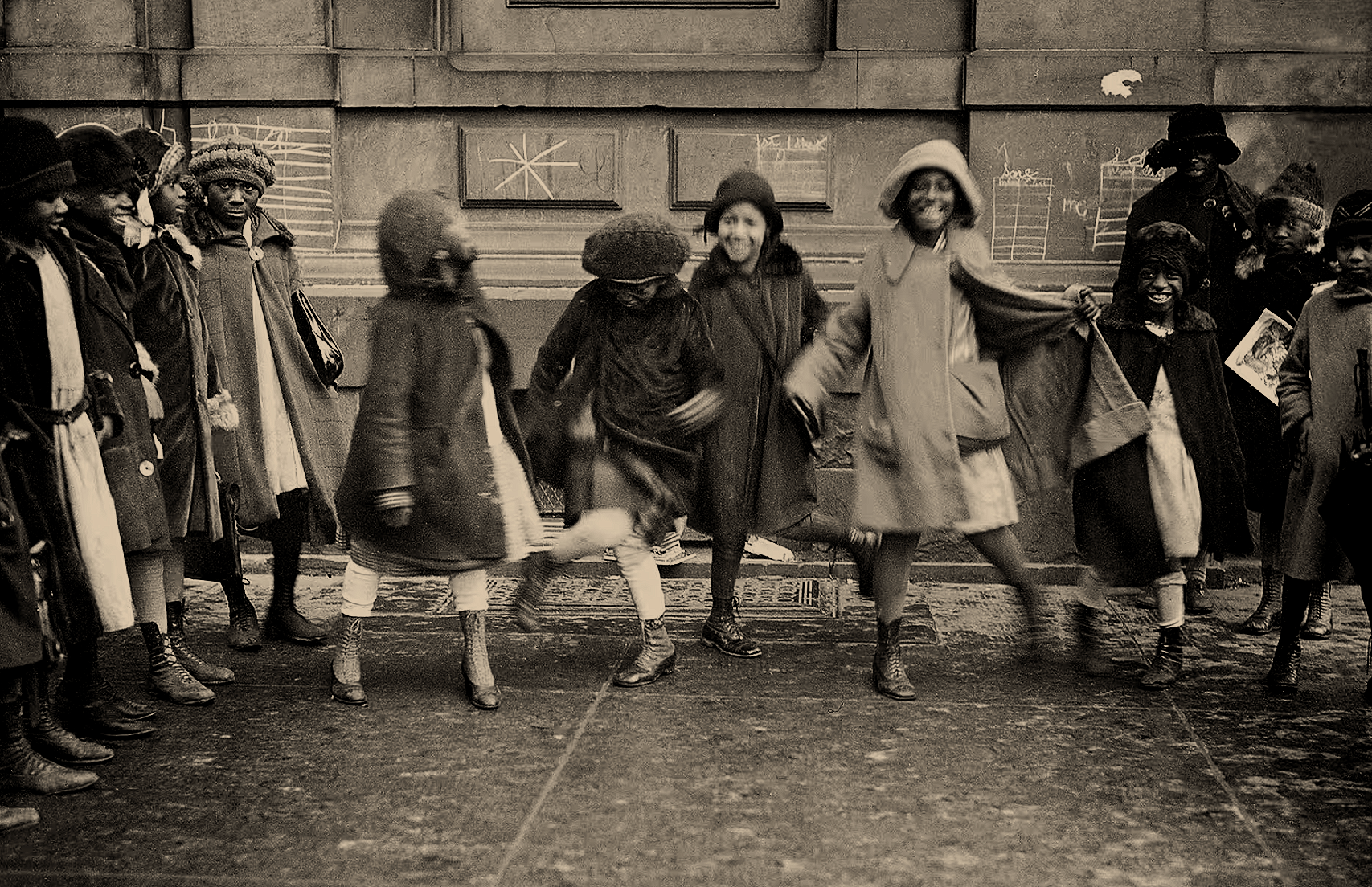 Children play on a Harlem street in the 1920s. 