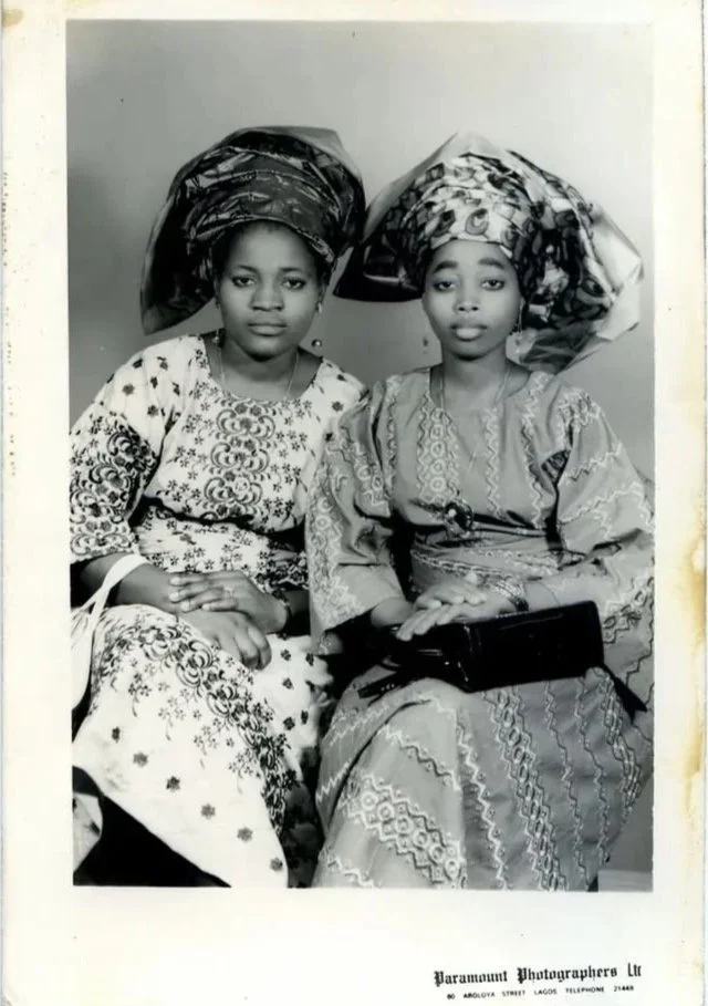 Nigerian women wearing Gele, Iro and Buba, photographed by Paramount Photographers Ltd, circa 1960s.