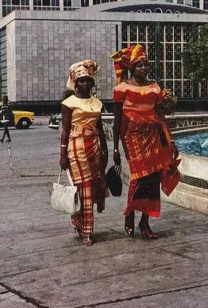 Two Nigerian women wearing traditional Iro and Buba, circa 1970s. 
