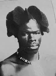 Zulu man with hair molded into flare panels. 