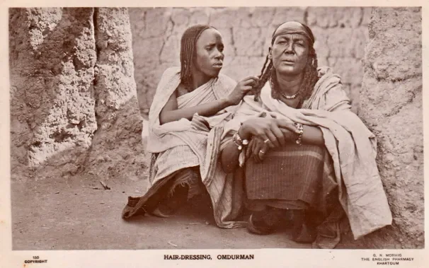 An Omdurman woman with mushat dressing her companion’s hair, (Morhig photography, 1905-1910, personal collection)