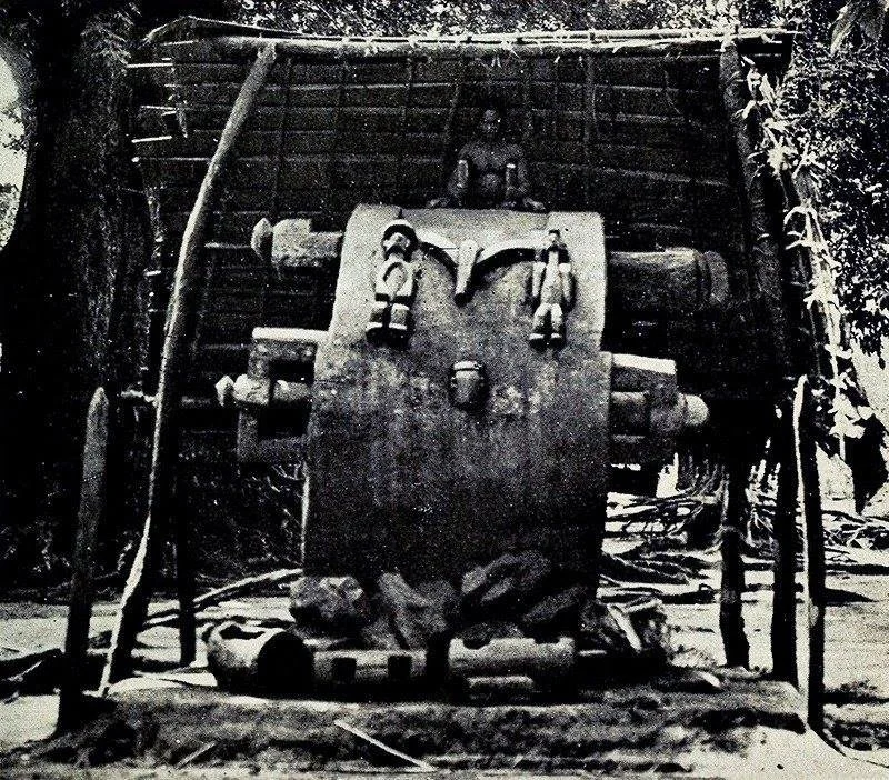The Ikoro Obibiaku, a giant ikoro (wooden slit drum) of Umunze made from a single oji (iroko) tree. Ikoro is beaten by males with sticks or by hand for either music, ritual purposes, or for sending messages. Photo: G. T. Basden, before 1921.

This ik