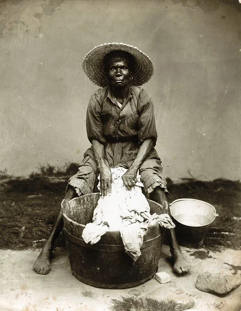 Cleary, J.W. (1890). Washer Woman. [Photograph]. The Caribbean Photo Archive. https://www.caribbeanphotoarchive.com