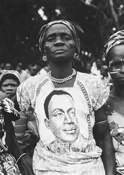 A woman wearing a President Houphouët-Boigny print dress, 1965.