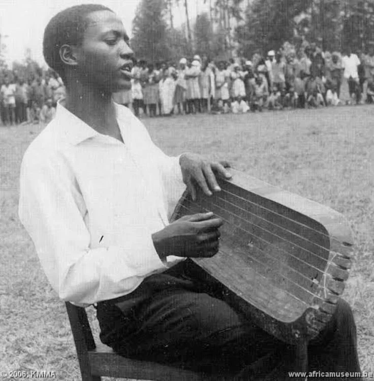 Man playing the inanga. 