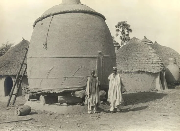 This image shows traditional Musgum mud granaries (or sometimes homes called Teluk) from the Lake Chad region of Cameroon and Nigeria. 