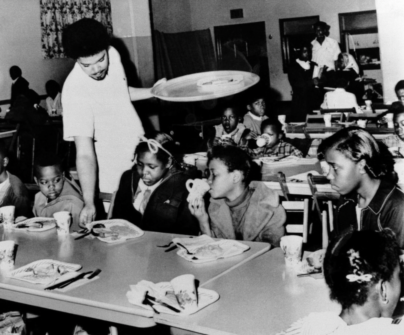 Bill Whitfield serving free breakfast to children in April 1969. Photographed by William P. Straeter.
